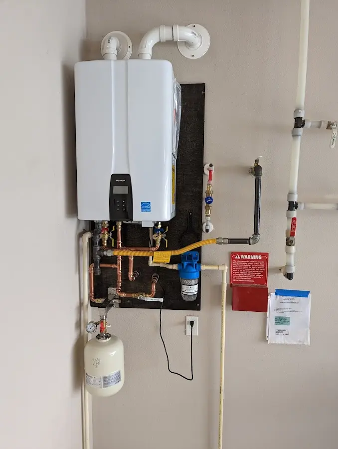 Professional plumber installing copper piping in a Pearl home